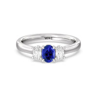 Created Sapphire Center And Oval Cut Three Stone Diamond Ring