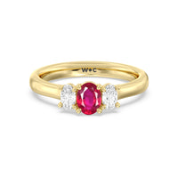 Created Ruby Center And Oval Cut Three Stone Diamond Ring