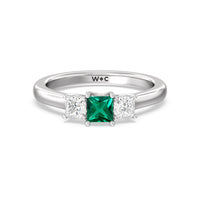 Created Emerald Center And Princess Cut Three Stone Diamond Ring